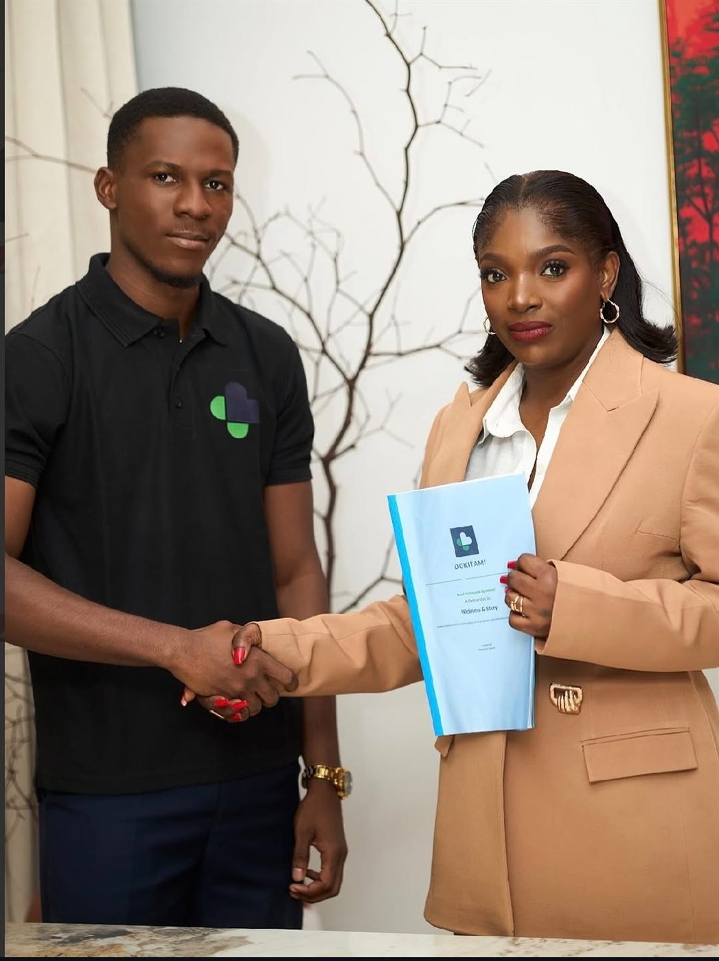 Dr. Tolulope Ajidahun signing the brand ambassador agreement with Annie Idibia on behalf of Dokitami in Lagos, Nigeria